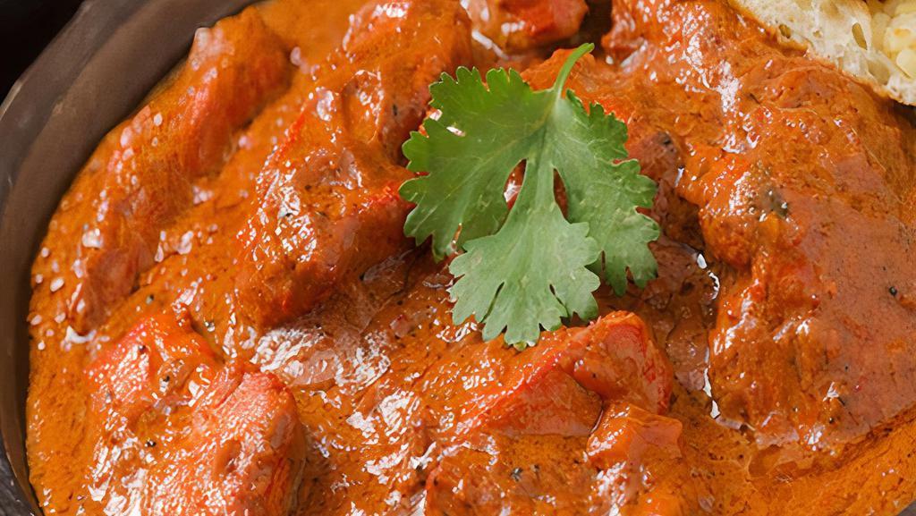CHICKEN TIKKA MASALA · Clay oven roasted chicken in creamy sauce tomatoes and spices.