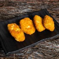 Oh - So - Good Fried Jalapeños · Feeling cooped up? Try a hot favorite! Fresh jalapeños and creamy cheese wrapped in batter a...