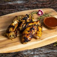 Jamaican Jerk Out (Spicy Wings) · Roost with the best! Jamaican Jerk Chicken Wings cooked with onion and chili based marinade ...