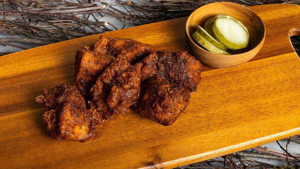 Fried Nashville Hot Chicken Tenders · Perfect pluck! Our extra crispy Nashville hot chicken tenders lightly battered and fried. Garnished with house seasonings and served with pickles.