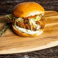 Terri - Fried Chicken Sandwich · Pig out on crispy fried chicken with caper aioli, lettuce, and tomato. Add some fries to com...