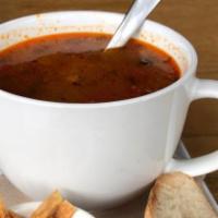 Aztec Pozole · New. Vegan homemade spicy hominy soup. Hominy, tomato, garlic, onion, cilantro, chipotle.