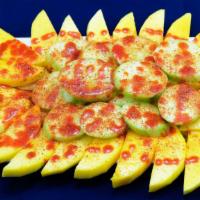 Botana Fruta Fresca · Fresh cucumber and mango slices, lightly salted, mild chili pepper, and lemon.