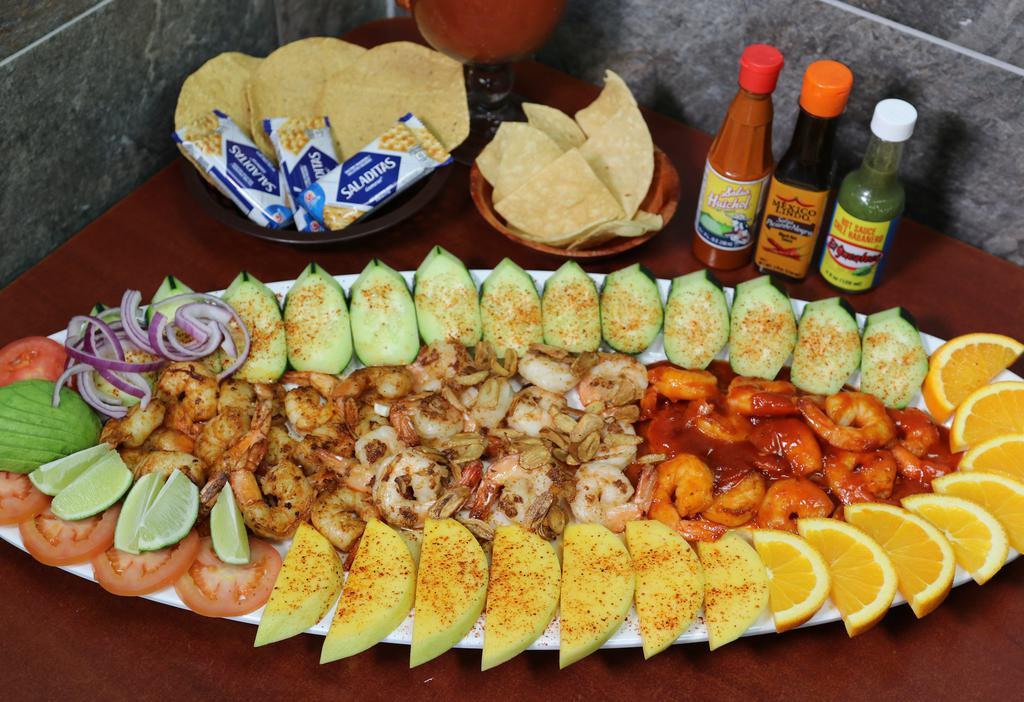 Botana Tequila's · Seafood tower, bathed in delicious tequila’s secret sauce and chiltepin
. Pepper, cooked shrimp, shrimp ceviche, fish ceviche, tuna, imitation crab, cooked octopus, purple onion, cucumber and avocado