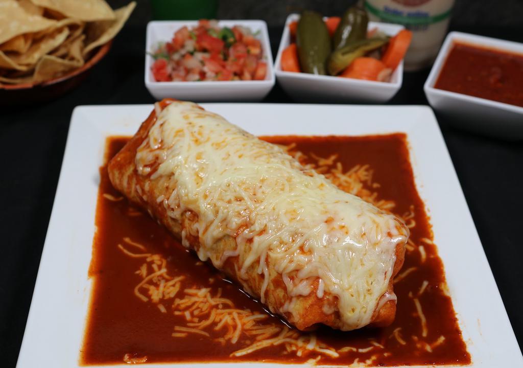 Super Burrito Mojado · 14” Flour tortilla covered with our homemade and delicious tomato sauce, stuffed with rice, whole beans, cheese, pico de gallo, fresh guacamole, sour cream, and your choice of meat.