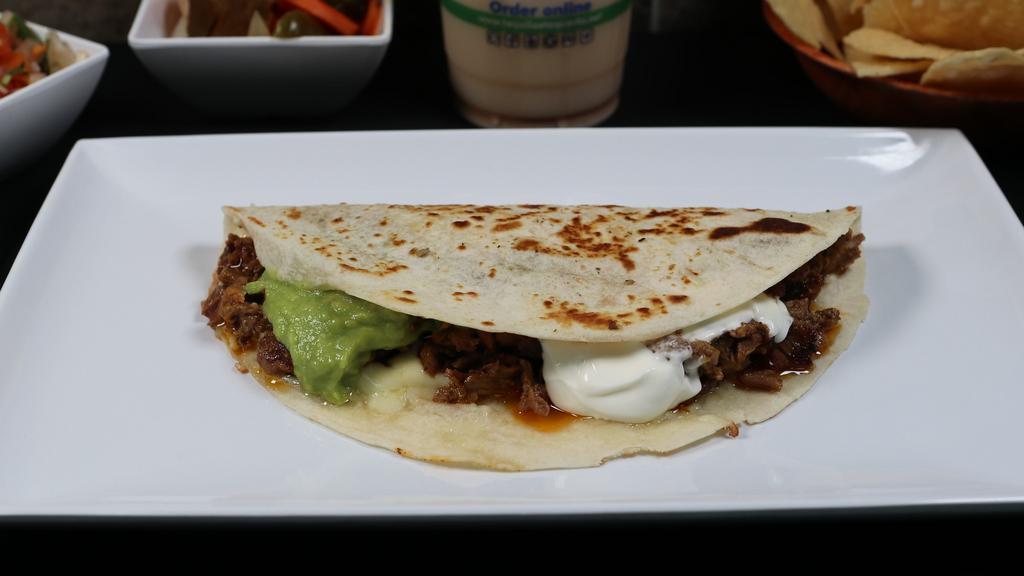  Super Quesadilla · 7” Flour tortilla filled with your favorite meat choice, creamy melted cheese, fresh guacamole, and sour cream.