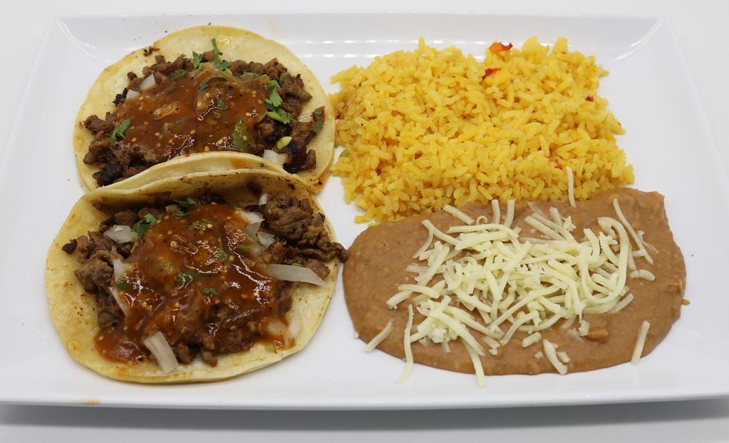 Double Soft Taco Combo · Two soft tacos, choice of meat, onion, cilantro, salsa, side of rice, and refried beans topped with cheese.