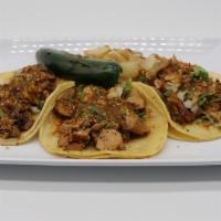 Soft Taco · Tasty corn tortilla, choice of meat, onion, cilantro, salsa.