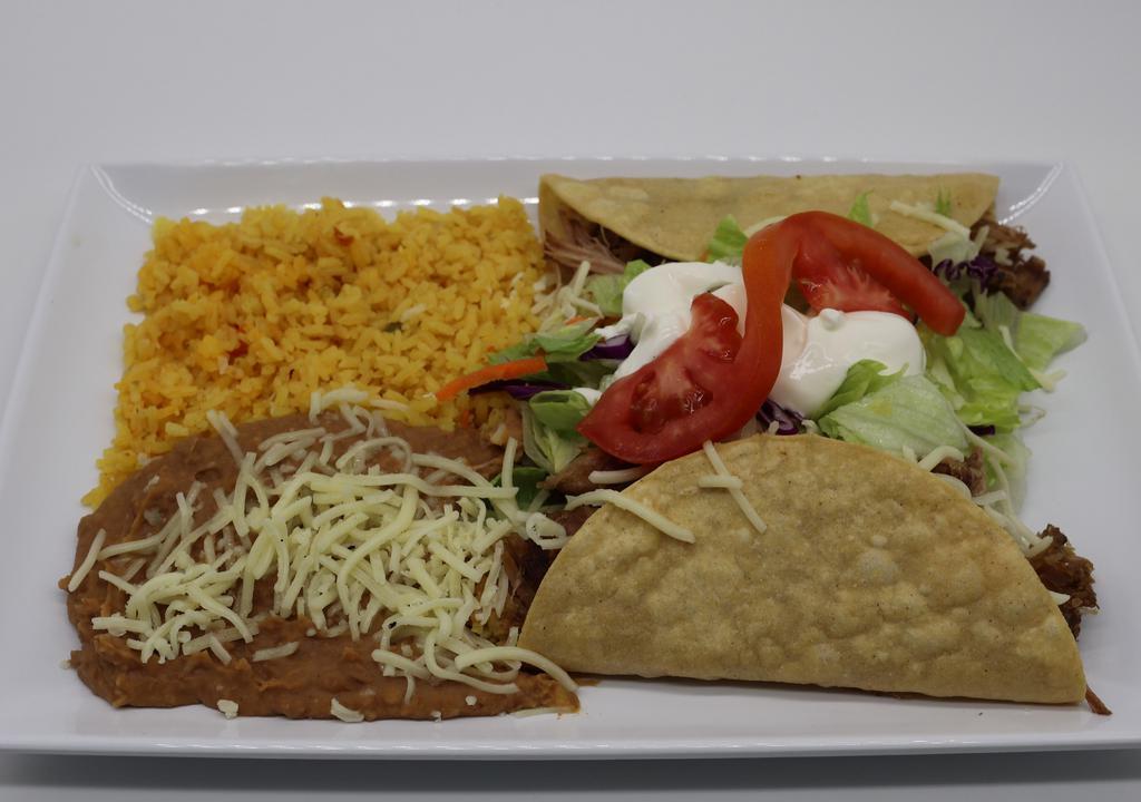  Double Crispy Taco Combo · 2 choice of meat. Two crunchy hard shell tortillas, filled with your favorite choice of meat, topped with cheese, sour cream, tomato, lettuce, served with rice and refried beans.