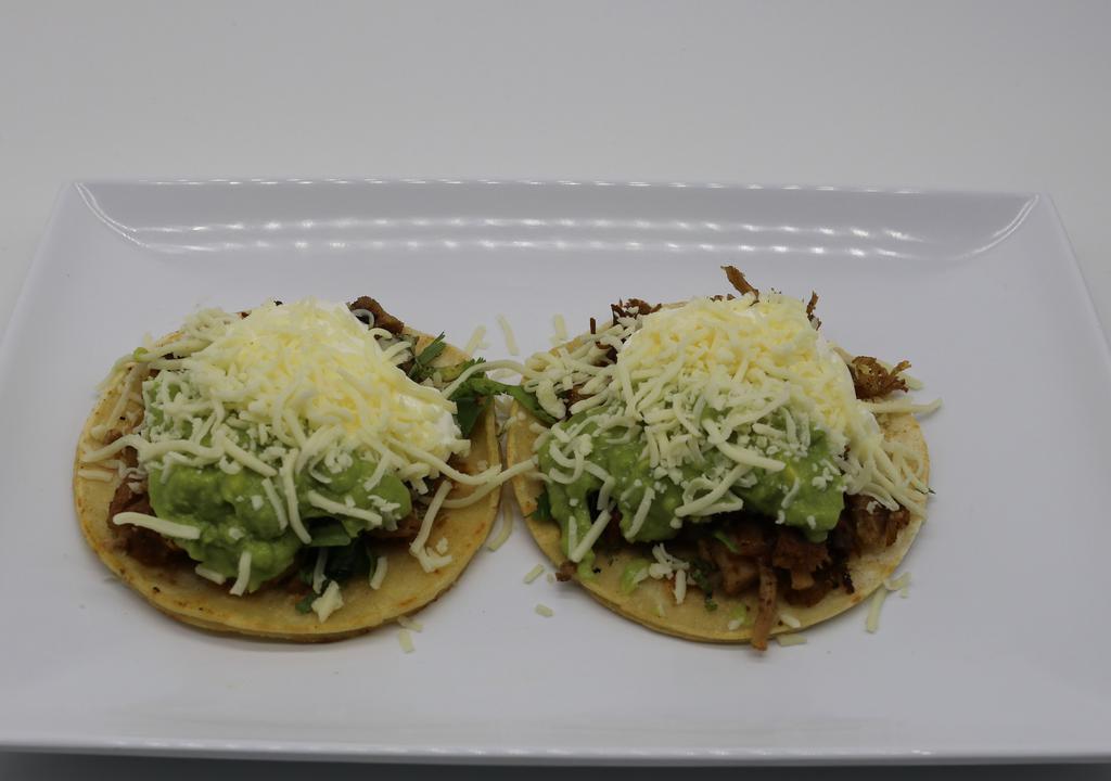 Super Taco · Corn tortilla, delicious choice of meat, fresh cheese, guacamole, sour cream, onion, cilantro, salsa.