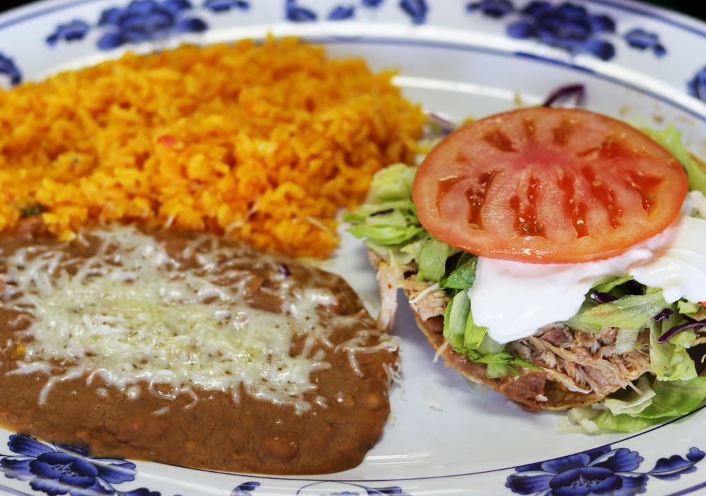 Tostada Combo · A Crunchy deep-fried tortilla, bottomed with a thin layer of rice and fried beans, topped with meat of your choice, cheese, sour cream, lettuce, and tomato, served with rice and fried beans.