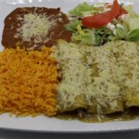 Green Enchiladas · Three rolled corn tortillas filled with your choice of meat, topped with our tasty homemade ...