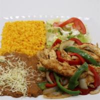 Chicken Fajitas · Tender thin chicken breast strips slightly spiced and cooked with red and green bell pepper,...