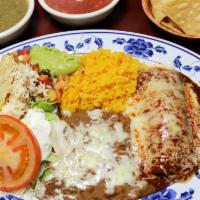  Combo Plate · One red enchilada and one crispy taco both filled with your choice of meat, served with sala...