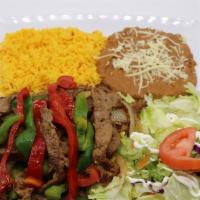 Beef  Fajitas · Delicious thin beef strips slightly spiced and cooked with red and green bell pepper, onion ...
