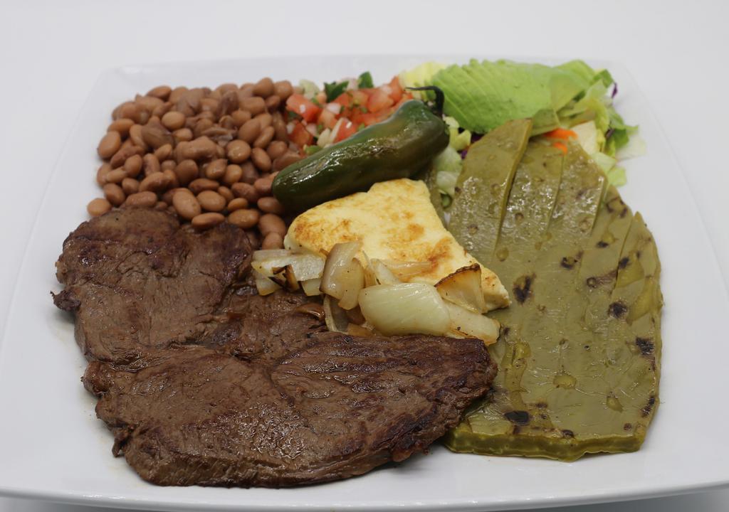  Tampiqueña · Carefully grilled skirt steak, Mexican cactus (prickly cactus), Fresh Mexican cheese, onions, and jalapeño all grilled to perfection, served with salad, whole beans, and fresh avocado slices.