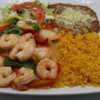 Camarones al Tequilazo · Fresh shrimp sautéed with wine and spiced with the secret recipe, green and red peppers, tom...