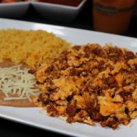 Huevos con Chorizo · Eggs and Chorizo, three eggs scrambled with tasty Mexican chorizo sausage served with rice, ...