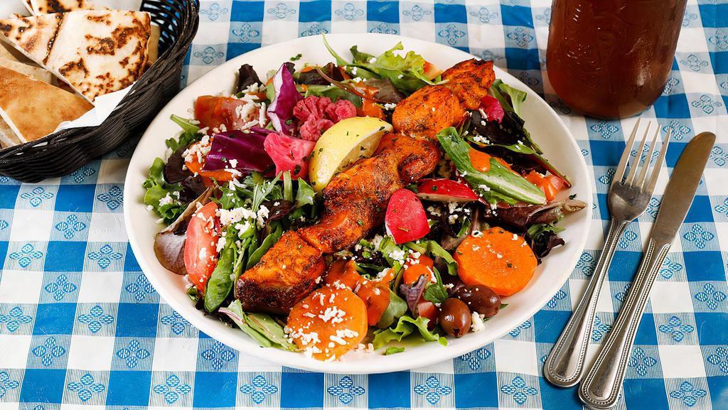 New! Grilled Salmon Salad  · Salmon marinated in a dill tomato sauce, skewered, grilled and served over organic mixed greens and fresh veggies with feta and house tomato vinaigrette (gf)