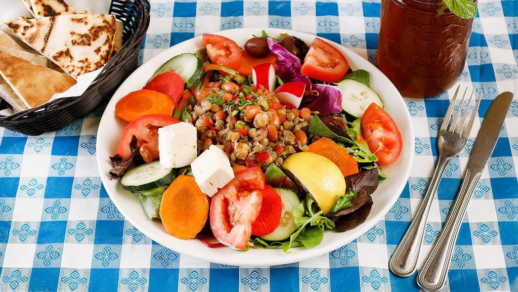Three bean Lentil Salad · Lentils, garbanzo, and red beans tossed with red bell pepper, herbs, lemon juice, olive oil over a bed of organic mixed greens, with tomato, cucumber, egg, and a sprinkle of feta cheese. Gluten free, vegetarian