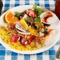 Saffron Chicken Kebab Lunch · Saffron and lemon marinated halal chicken breast, grilled and served over rice pilaf. (gf)