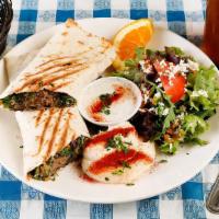 Lamb Shawarma · Spiced and baked Superiod Farms halal lamb, wrapped in lavash bread with greens, served with...