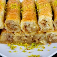 Baklava 2 pieces · Baklava is a rich, sweet pastry made of layer of filo filled with chopped pistachio and waln...