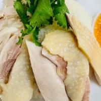 Hainan Chicken Rice · Steamed free-range chicken served over fragrant rice and served with our homemade garlic, gi...