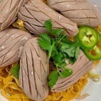 10. Pork Kidney Noodles · Sliced pork kidney garnished with green onions, cilantro, fried garlic, and a touch of sesam...