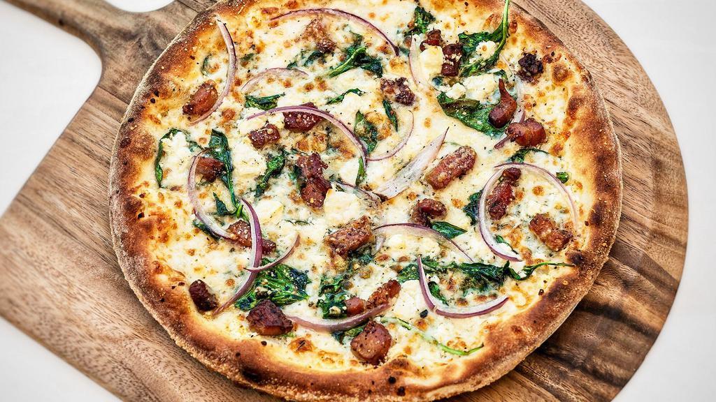Gluten Reduced Trentino Pizza · Mozzarella, parmesan, crumbled feta, baby spinach, red onions, pancetta, herbs, Meyer lemon olive oil no tomato sauce.