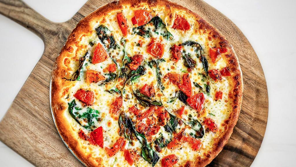 Margherita Pizza · Vegetarian. mozzarella, tomatoes, fresh basil, olive oil. choose tomato sauce or not.