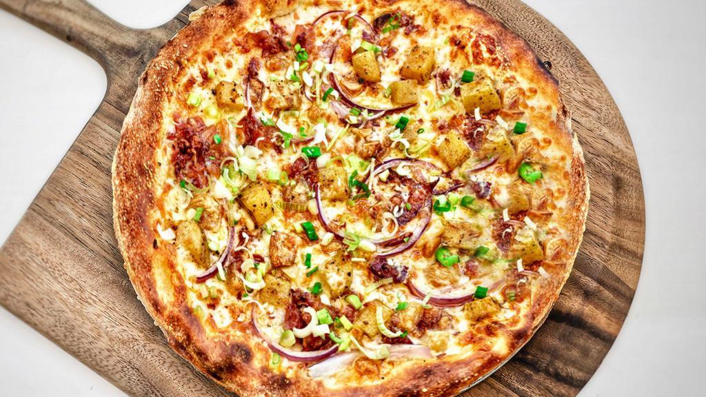 MILANO · mozzarella, provolone, roasted Yukon gold potatoes, bacon, slow-roasted garlic, red and green onions, hot red pepper flakes (no tomato sauce)