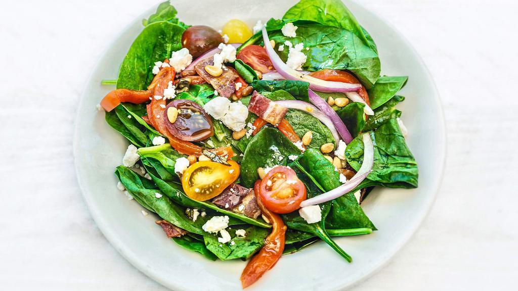 SPINACH SALAD · with roasted red peppers, red onion, tomato, bacon, crumbled feta, toasted pine nuts served with our lemon basil vinaigrette