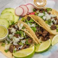 Tacos · Two soft corn tacos with choice of meat.