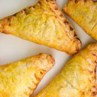 Chicken Empanada · Baked pocket of pastry dough with a savory filling.