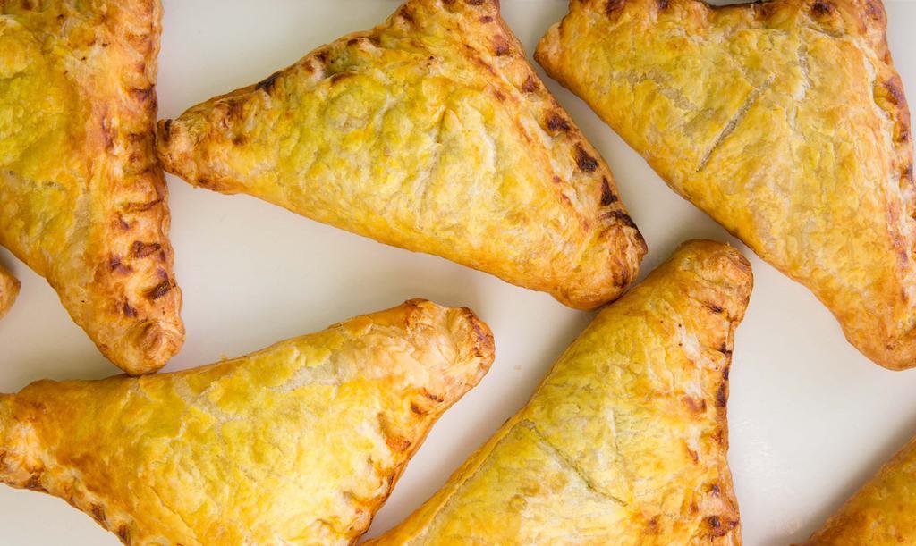 Chicken Empanada · Baked pocket of pastry dough with a savory filling.