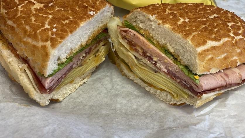 Godfather II · Only the finest dried meats from molinari - spicy coppa, mortadella, prosciutto, spicy salami, pepper jack cheese, spicy oil and vinegar, lettuce, onions, cherry peppers, artichoke hearts.