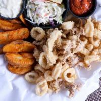 #10 - Calamari · Calamari, rings and tentacles, served with chips & coleslaw