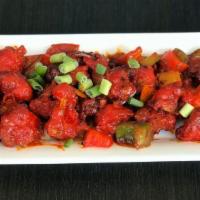 Chilli Gobi · Crispy and crunchy cauliflower florets coated with chilli flakes, tomato ketchup and soy sauce