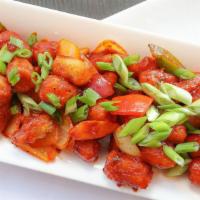 Chilli Baby Corn · Slightly battered and Deep Fried babycorn tossed with Onions and Chilli Sauce