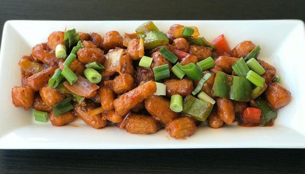 Baby Corn Manchurian · Baby corn dipped in a batter primarily made of corn flour, maida (soft wheat) and soy sauce and fried and sautéed with green onions, soy sauce & Indo-Chinese manchurian sauce