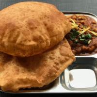 Chole Bhatura · Soft leavened refined flour bread deep fried and accompanied with Channa Masala