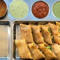 Spring Dosa · South Indian crepe delicacy made with rice flour and Lentil batter layered with roasted vege...