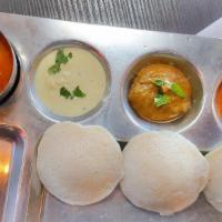Idly (3 PCS) · Steamed Rice and Lentil Cake accompanied with Sambar, and Chutneys served steaming hot