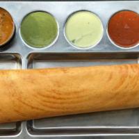 Plain Dosa · South Indian crepe delicacy made with rice flour and Lentil batter served with Chutneys and ...