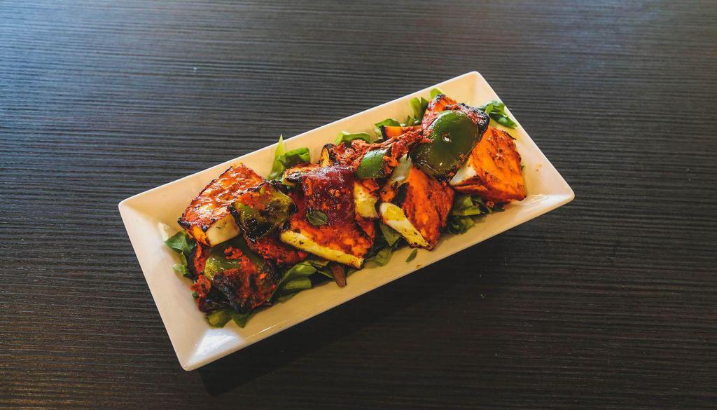 Paneer Tikka Kebab · Indian cottage cheese squares marinated in the traditional tikka masala and slow cooked in Tandoori