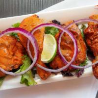 Tandoori chicken · Whole Chicken Leg marinated overnight with a mix of herbs and the traditional tandoori mix a...