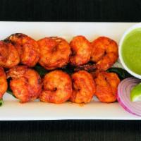 Tandoori Shrimp · Raw shrimp pieces marinated in traditional Indian mixture of spices and yogurt and slow cook...