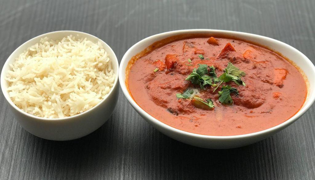 Chicken Tikka Masala · Boneless Chicken Chunks Clay oven roasted and cooked in a rich blend of Cream and Curry Sauce and mixed with vegetables.