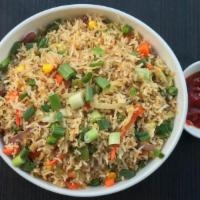 Vegetable Fried Rice · Stir-fry the cooked rice, onion, garlic and mixed vegetables with soy sauce.